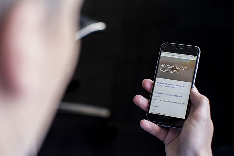 Customer receiving appointment details on mobile phone