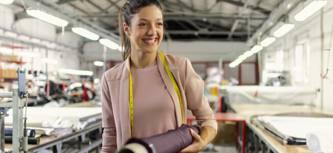 A female tailor smiling A female tailor smiling